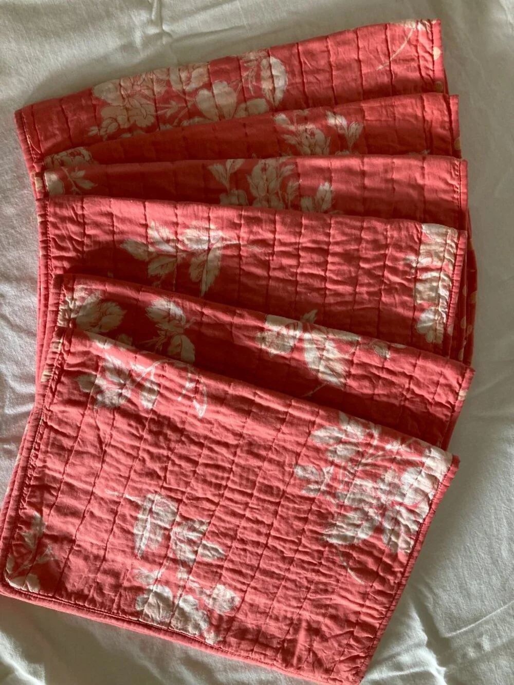 6 new April Cornell quilted floral placemats, coral pink, + 1 used, 7 total